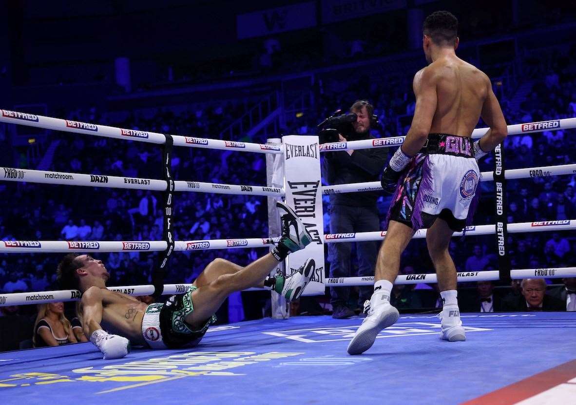 Jordan Gill knocks over Michael Conlan in Round Two. Picture: Mark Robinson (Matchroom Boxing)