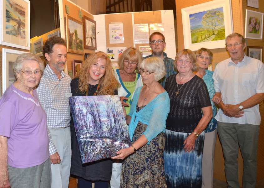 The annual St Matthew's Art Exhibition at St Matthew's Church, Suttton Bridge, where landscapes and portraits by artists and organisers include those oof (from left) Addy Garwell, Geoff De Roux, Lesley Robinson, Andrea Taylor, Sandra Carpenter, Mark Vickers, Margaret Pratt, Maureen Hunt and Bernard Pratt. Photo by Tim Wilson.