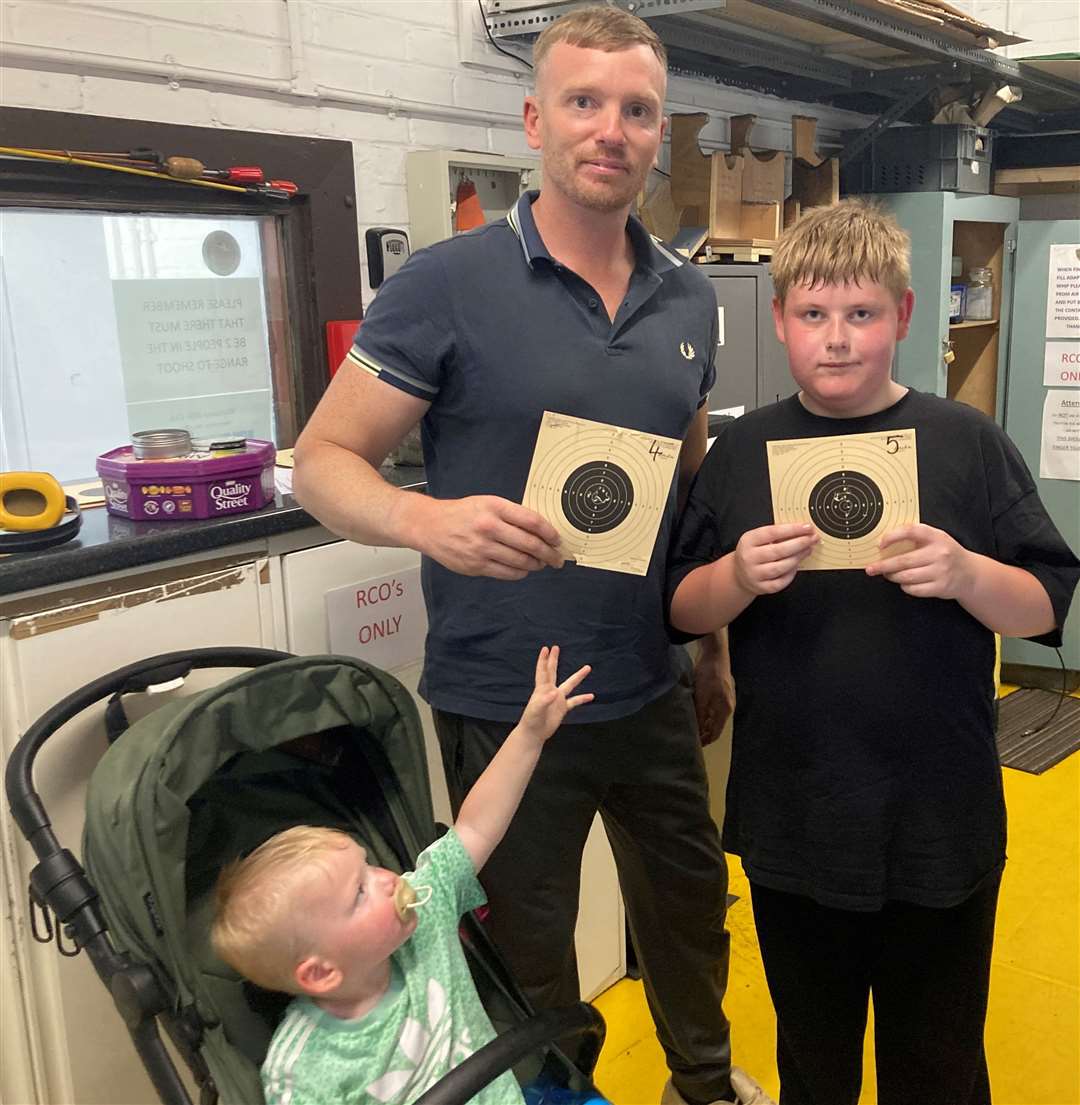 Phil and Rowen Lowndes show off their first-time target shooting skills at one of the club's hugely successful family open days in June. Picture: Whittlesey Rifle Club