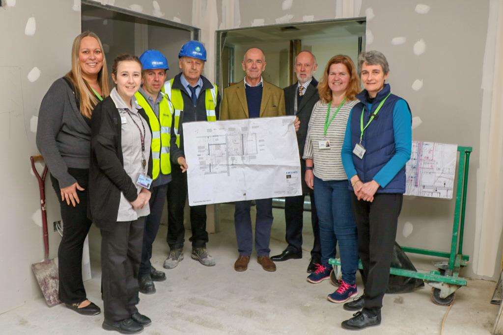 Some of the Alan Hudson Day Treatment Centre team, alongside builders from the Coulson BuildingGroup – who have now started work on the expansion and redevelopment project at the North CambsHospital site – and representatives from The Hudson Foundation. Left to right: Alison Stickle (Administrator,Alan Hudson Day Treatment Centre), Emily Sibthorpe (Student Nurse, Alan Hudson Day Treatment Centre),Matthew Sizer (Senior Manager, Coulson Building Group), Ged White (Site Manager, Coulson BuildingGroup), Edward Newling (Trustee, The Hudson Foundation), David Ball (Chair, The Hudson Foundation), JudiDuffy (Creative Arts Coordinator, Alan Hudson Day Treatment Centre) and Phillippa Ashcroft (ProjectDevelopment Officer, Alan Hudson Day Treatment Centre). (6780259)