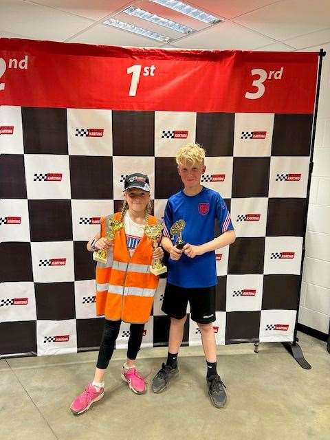 Alfie (right) pictured with his younger sister Maisy, and some of his trophies