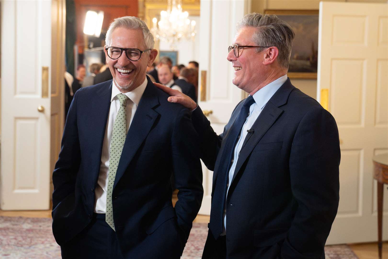 Sir Keir Starmer laughing with Gary Lineker during a reception to celebrate St George’s Day (Stefan Rousseau/PA)
