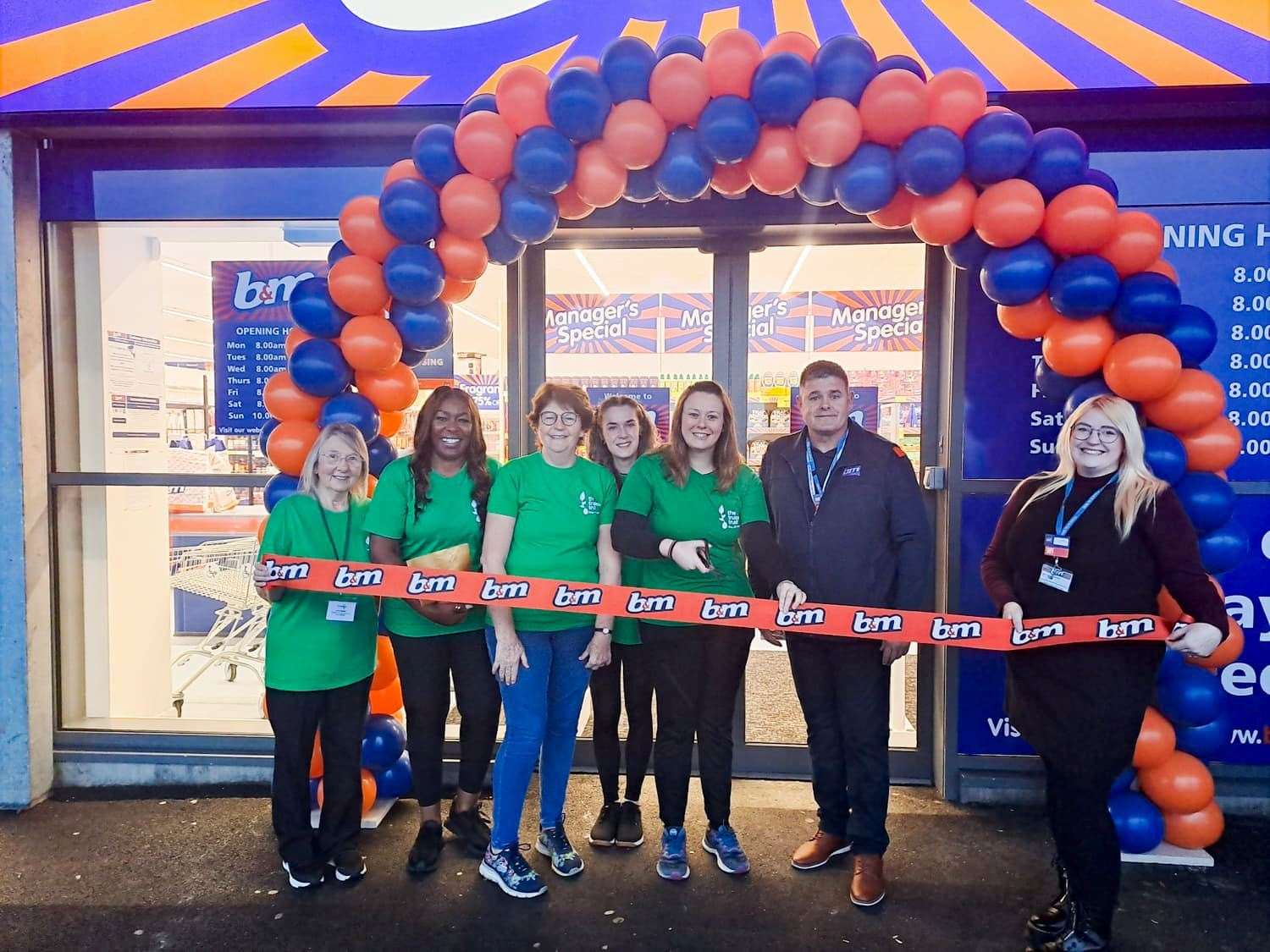 The Chatteris Foodbank Volunteers cut the ribbon to officially open the new B&M store in Chatteris.