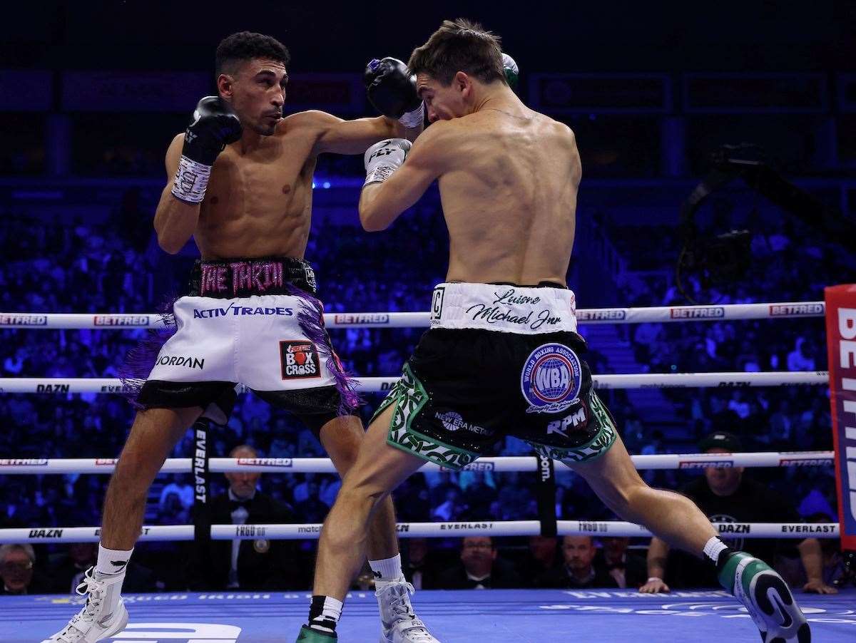 Jordan Gill lands another punch against Michael Conlan. Picture: Mark Robinson (Matchroom Boxing)