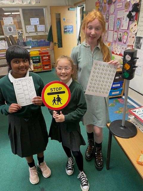 Pictured are Year 5 children who led an assembly and organised a walk to school week poetry writing competition plus some of the fancy footwear that was worn.