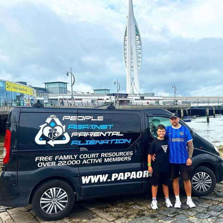Simon and his son in front of The Spinnaker Tower in Portsmouth