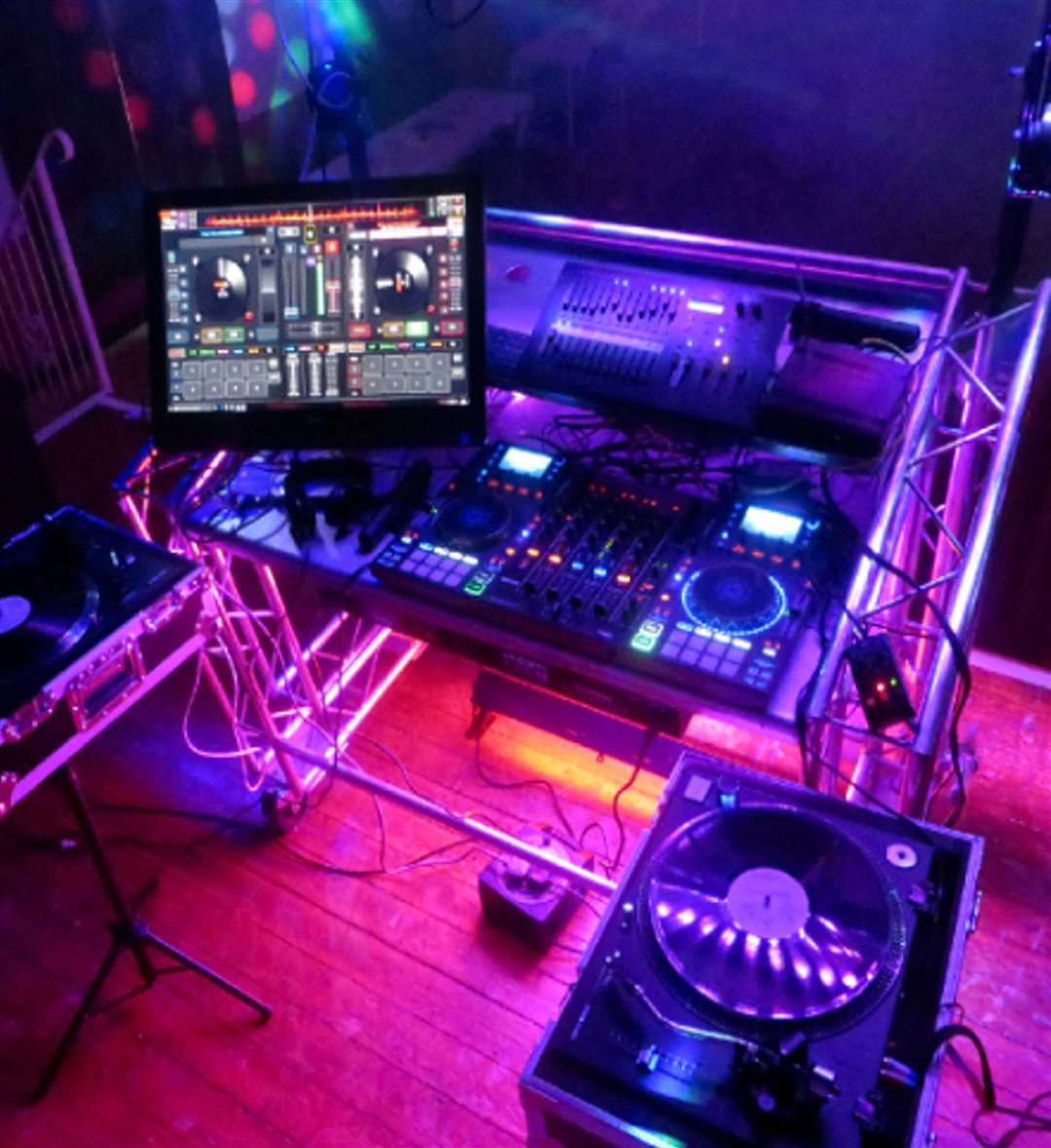 Tim Daymond, has been a professional DJ known as Tinsel Tim since 1976. He began his career with a floor-to-ceiling vinyl collection used for playing tracks. But as times have changed he's upgraded to QR codes and livestreamed wedding parties to those who can't make it