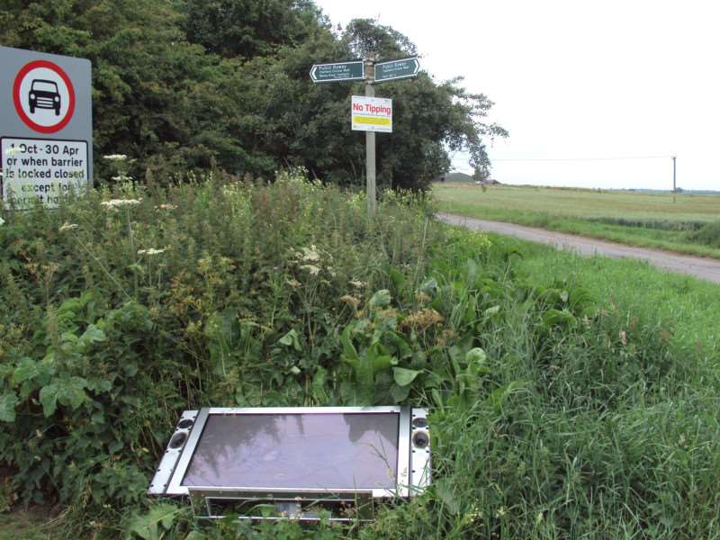Blatent disregard: The TV dumped by Stevie and Emma Jackson - right next to 'No Tipping' sign.