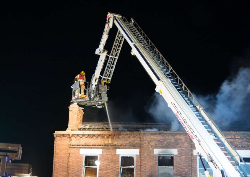 Firefighters tackle the blaze from above. Photo: Dave Hudson Photography.