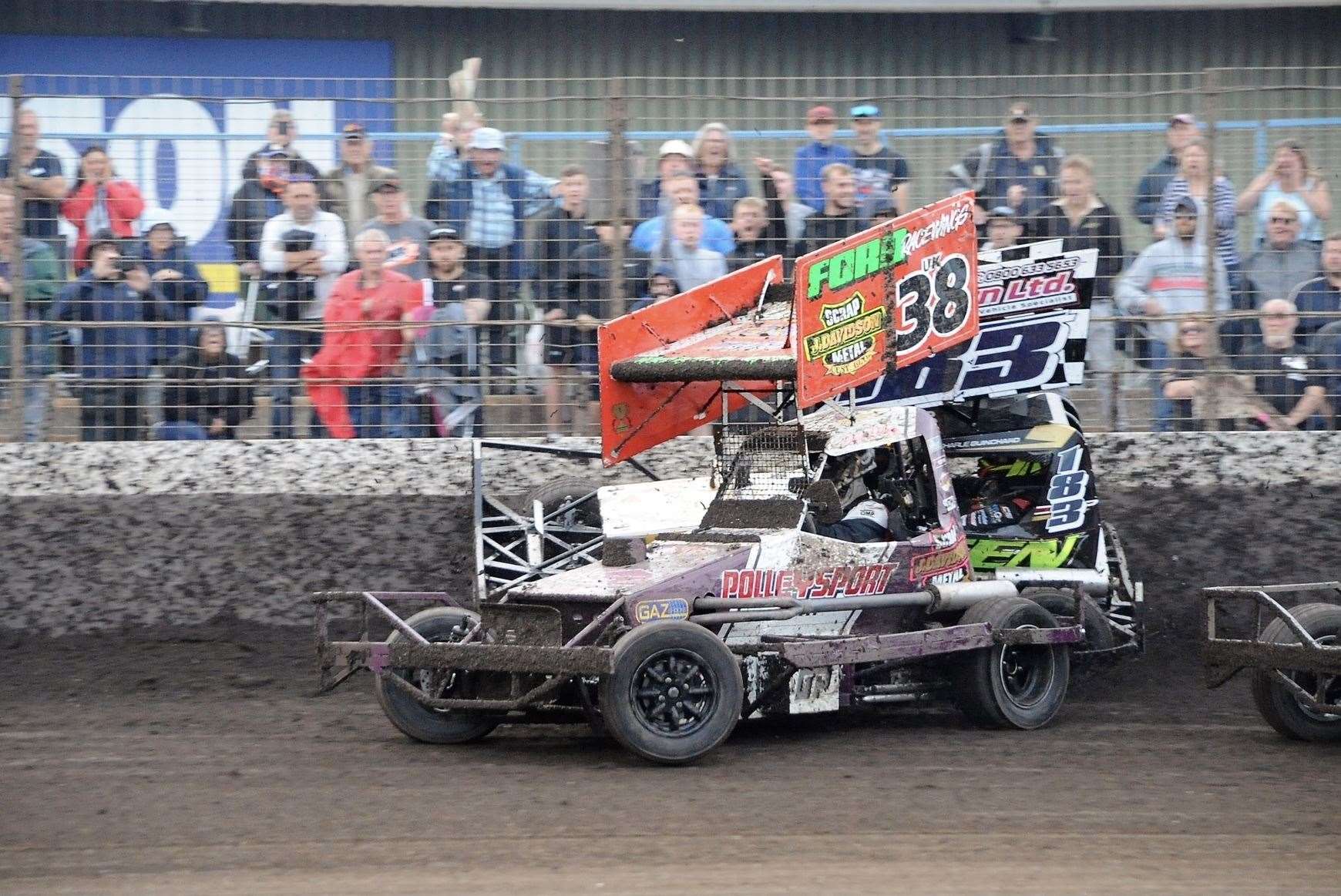 The decisive moment as leader Charlie Guinchard is slammed into the fence (Picture: Colin Casserley)