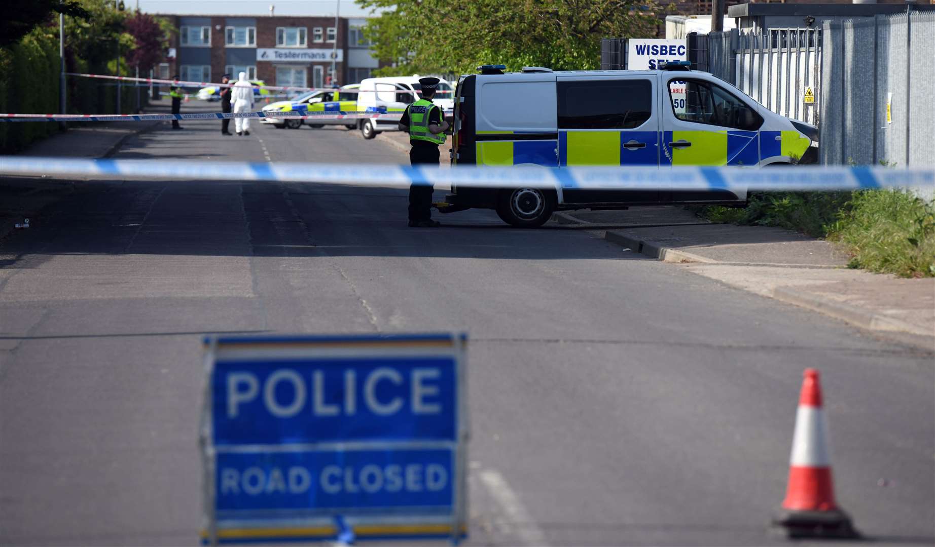 Police at the scene of the alleged murder in Sandall Road, Wisbech.