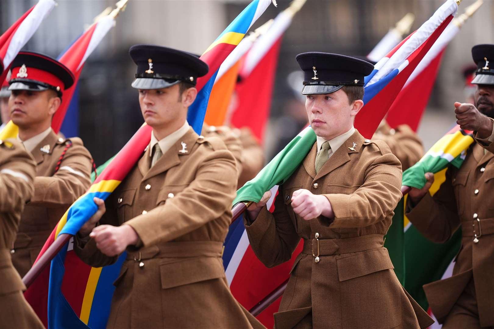 Members of the Colour Party carry flags of the Commonwealth nations (James Manning/PA)