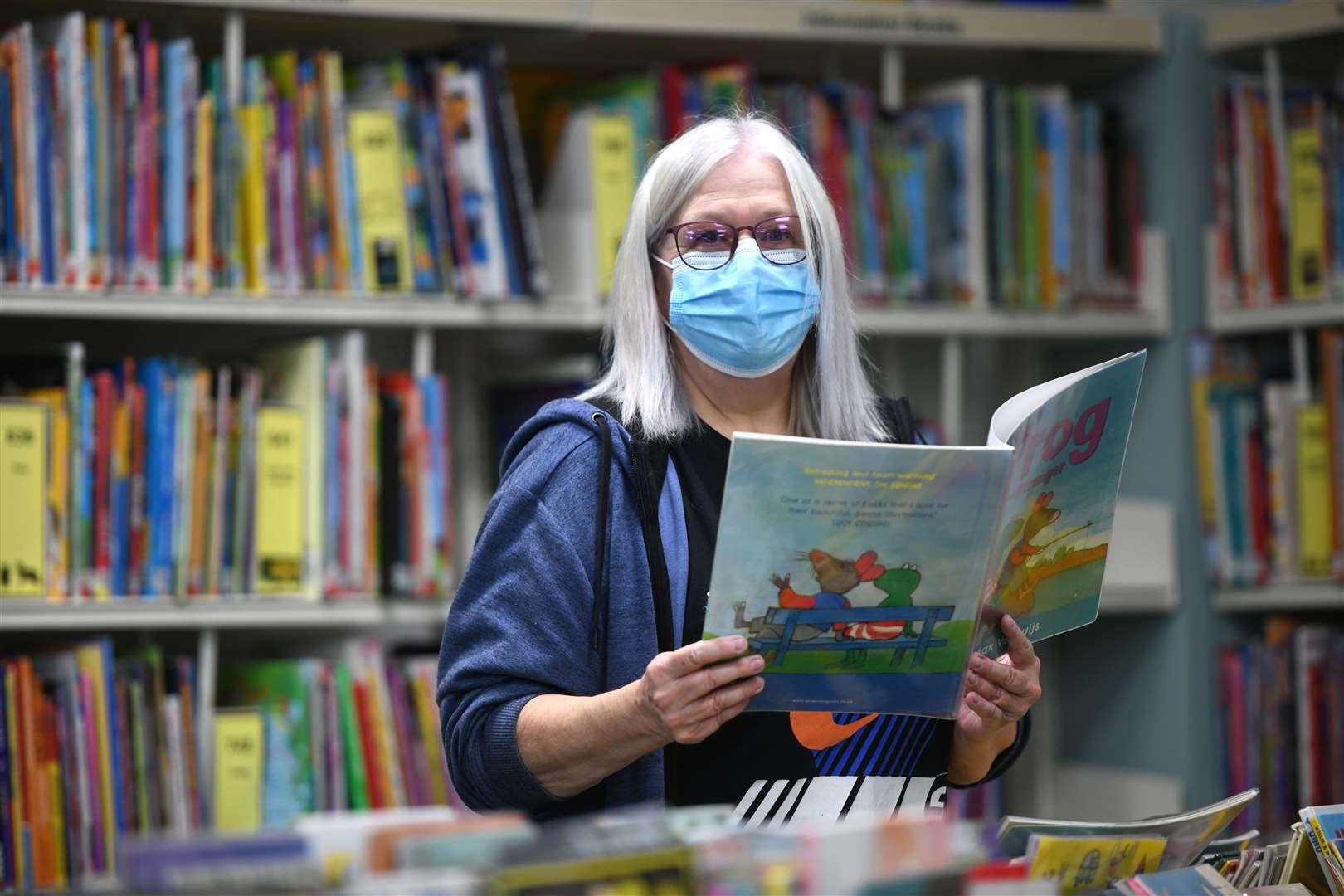 Rosie Rawling community library assistant - among the library's extensive children's section.