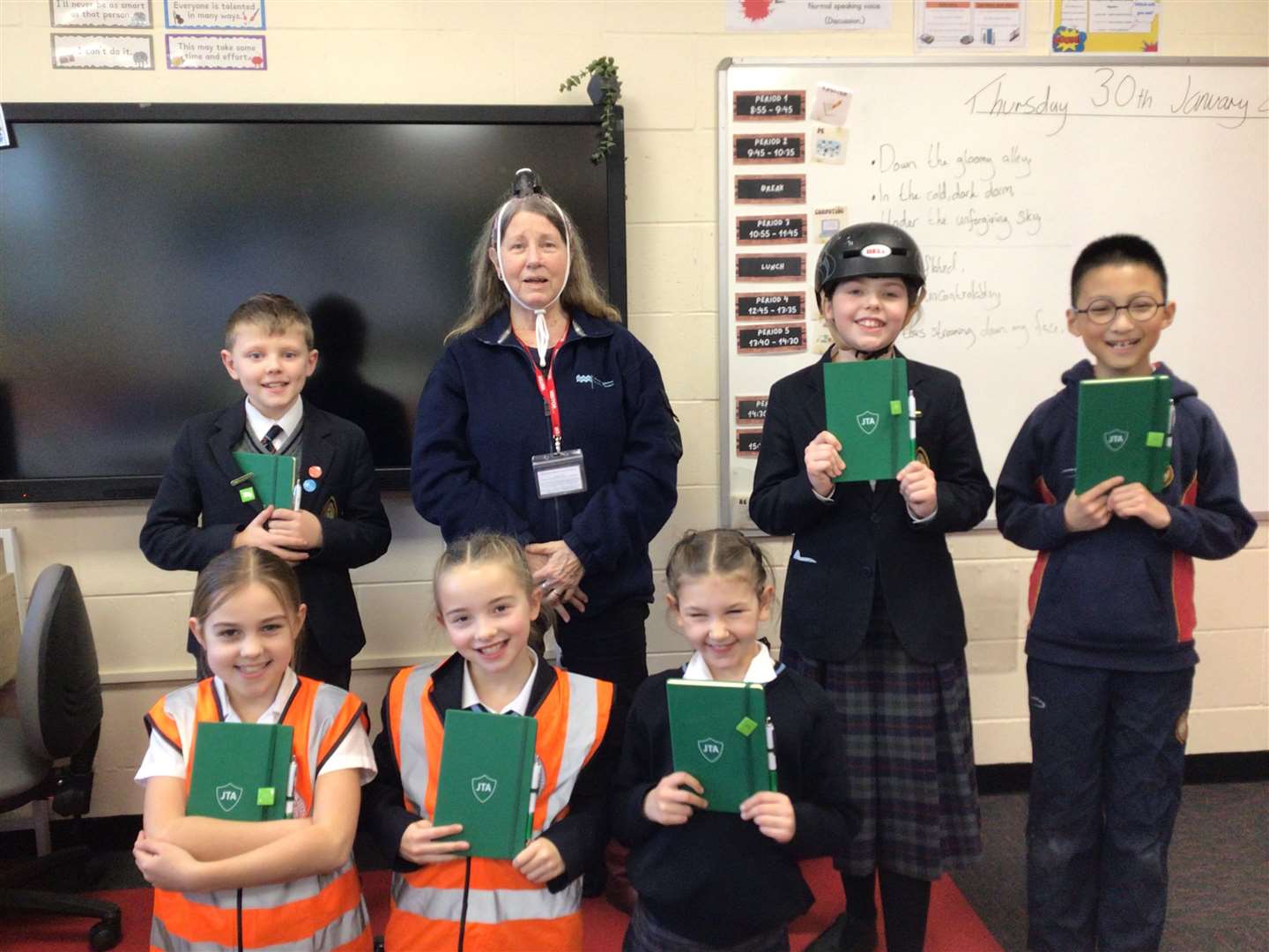 Pupils with their badges and notebooks