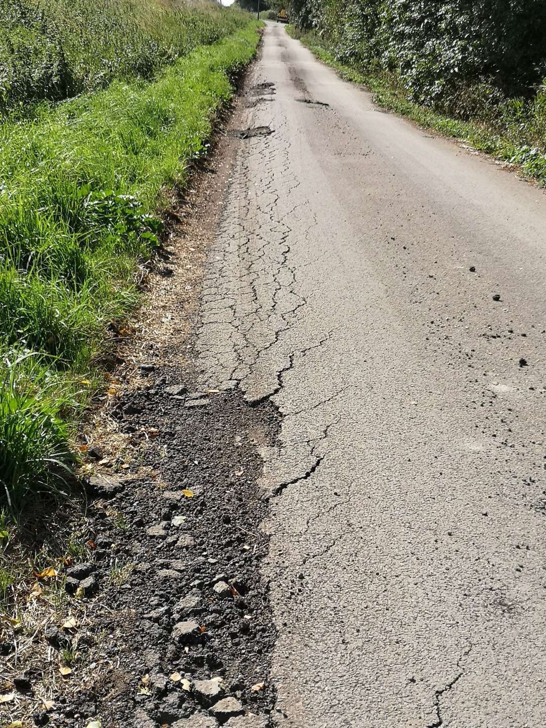 Heavy lorries have caused major damage to a minor village road. (16207174)