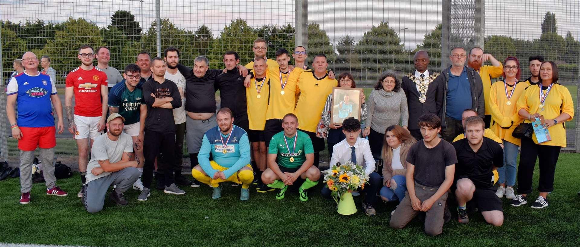 Greencore colleagues together with the Mayor and Josh's family at the charity football match in his memory.