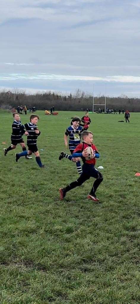 A Wisbech U9s Wildcat on the way to the try line (61874157)