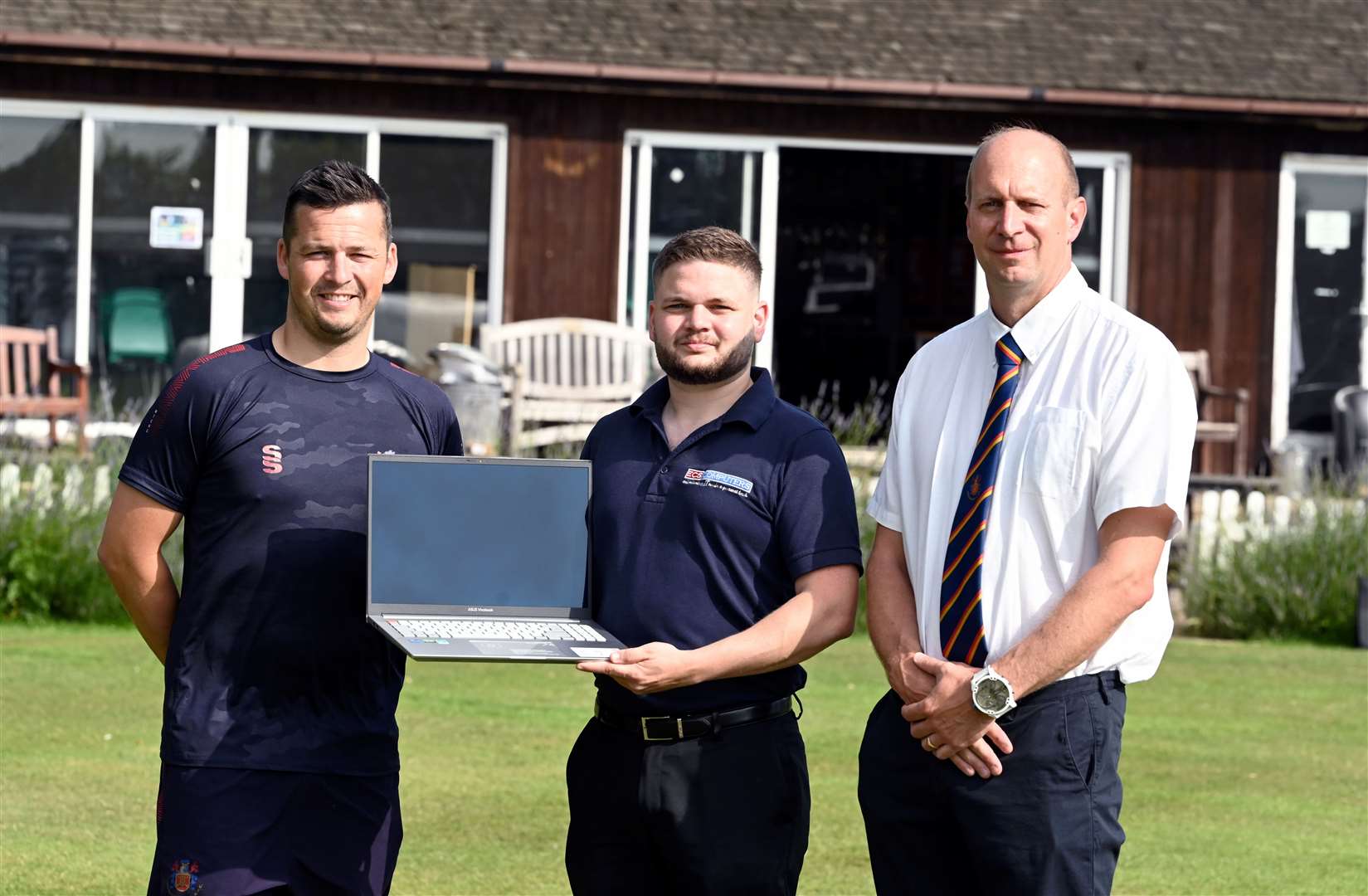 ECS Computers presented Wisbech Cricket Club with a laptop on Saturday so they can live stream their first team games. Pictured, from left, are captain James Williams Captain, ECS sales manager Liam Johnson and cricket club committee member Martin Woollard.