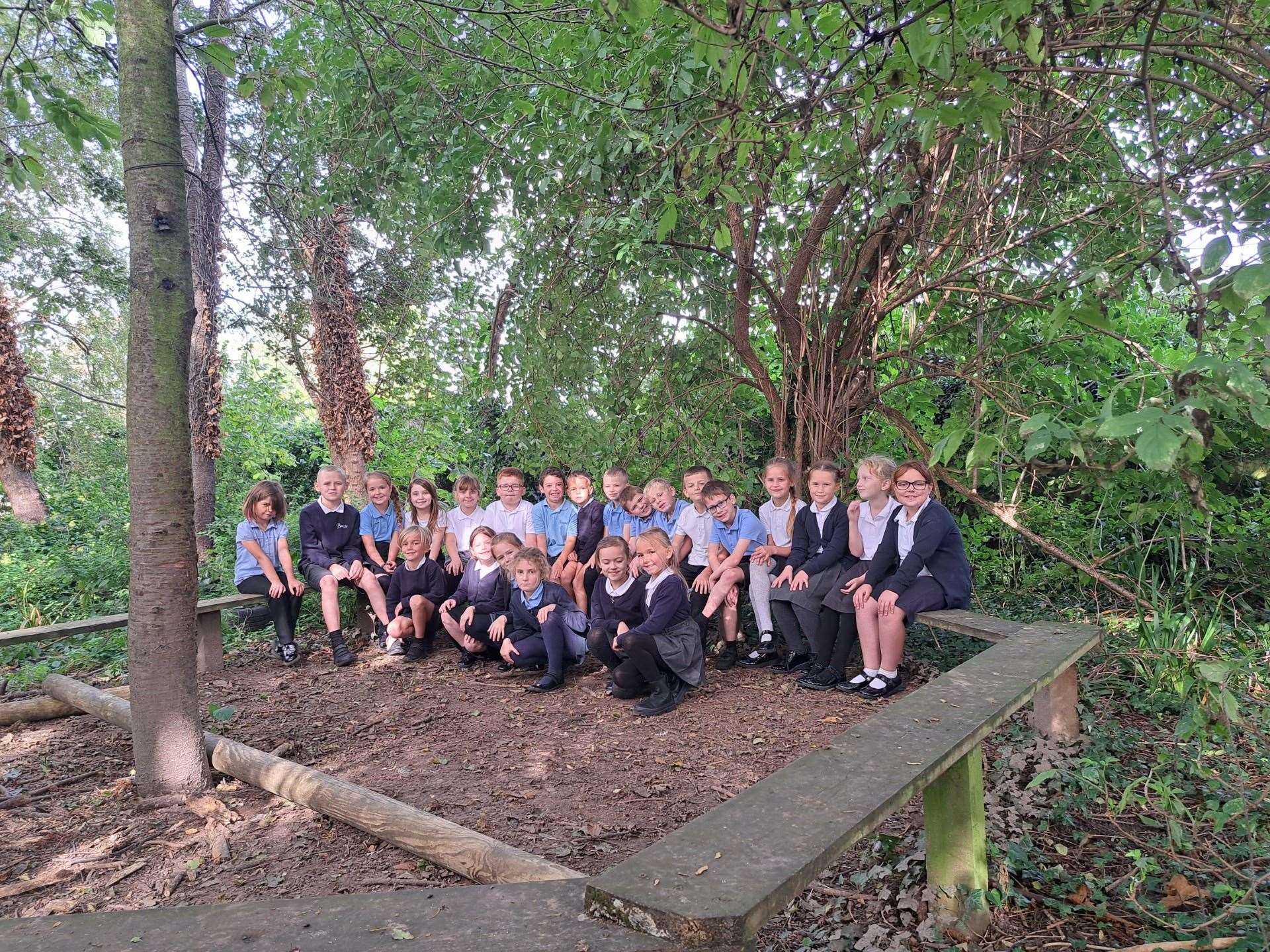 Some of the pupils in the school's forest area, which it is hoped will be enhanced by the project.