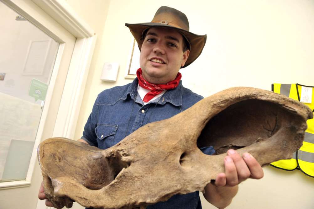 Fossils Galore Jamie Jordan with the new woolly rhino exhibit ANL-151204-175313009