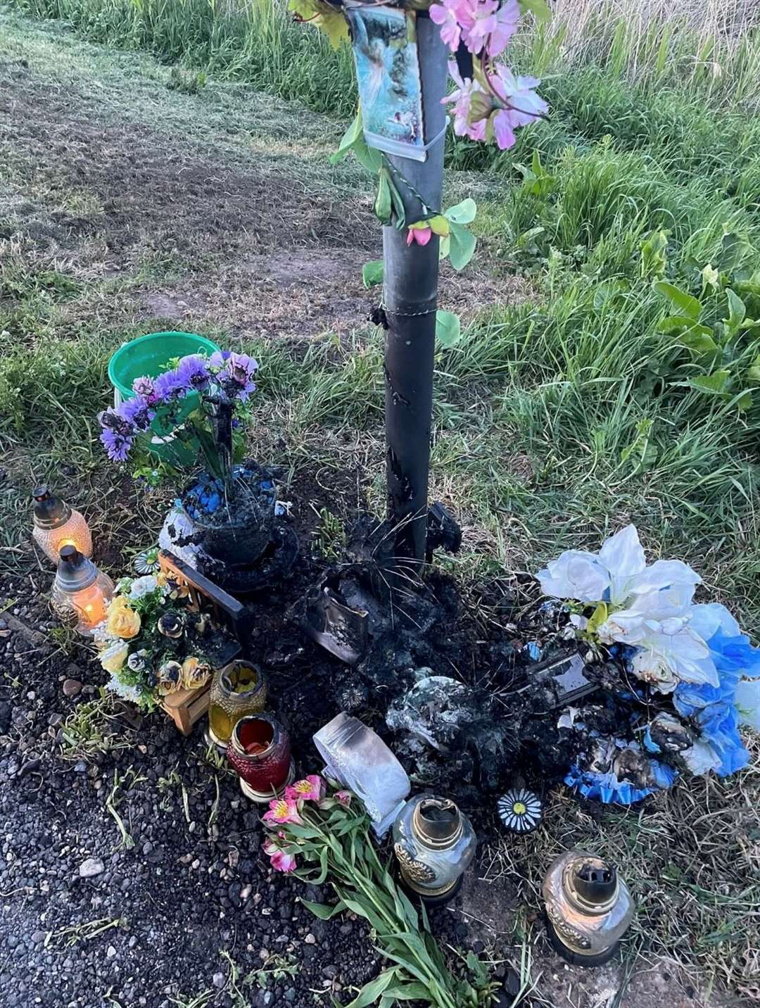 Flowers and other tribute items were burnt
