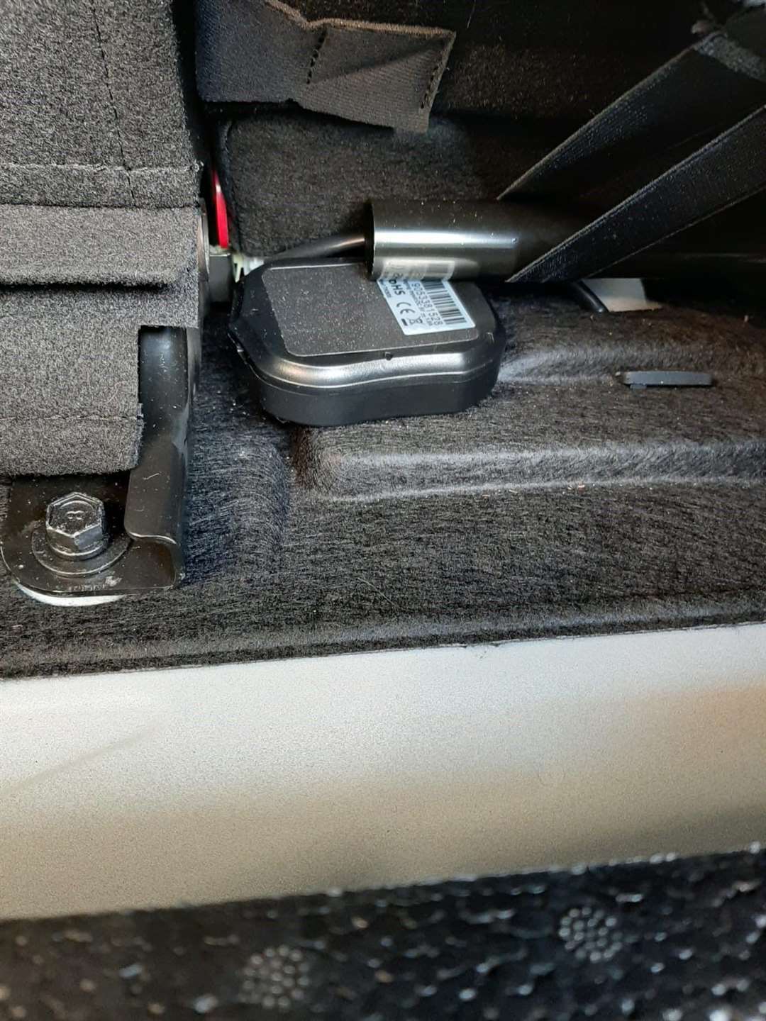 The tracker device planted in the victim's car. (49694957)