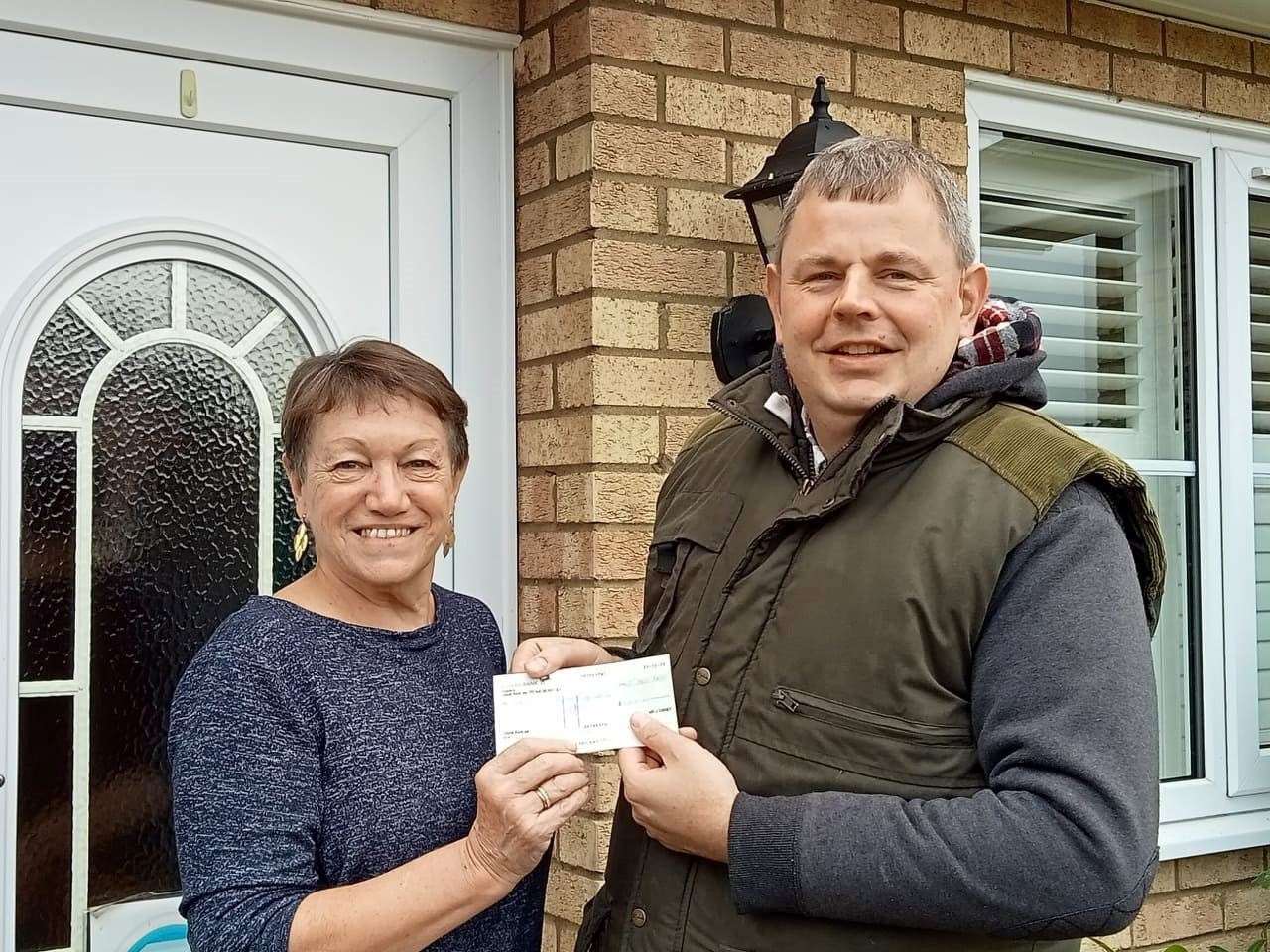 Councillor James Carney presents the cheque to Lynda Behagg, of Chatteris Royal British Legion Branch. (53811182)