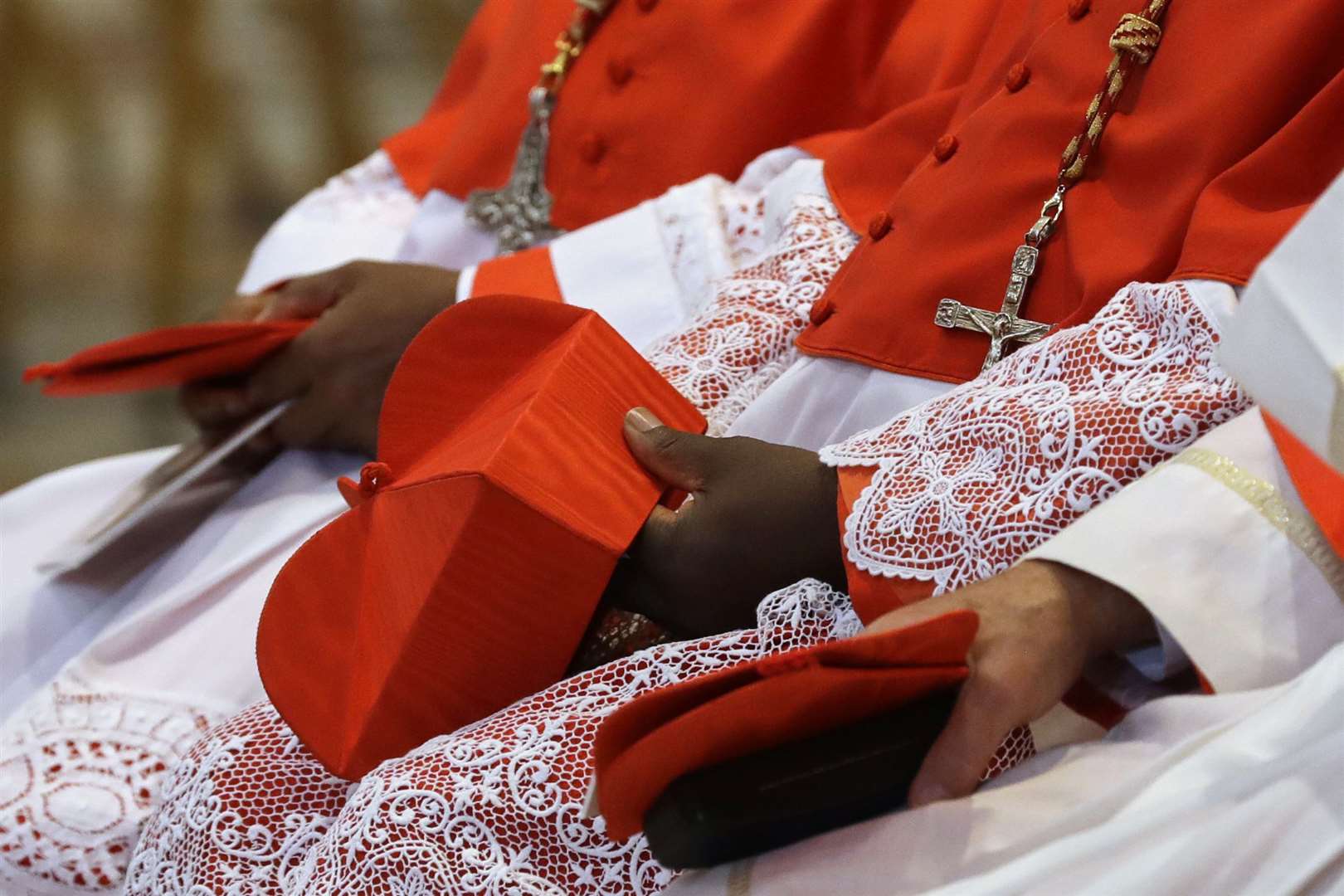 Cardinals inside St Peter’s Basilica at the Vatican (Gregorio Borgia/AP)
