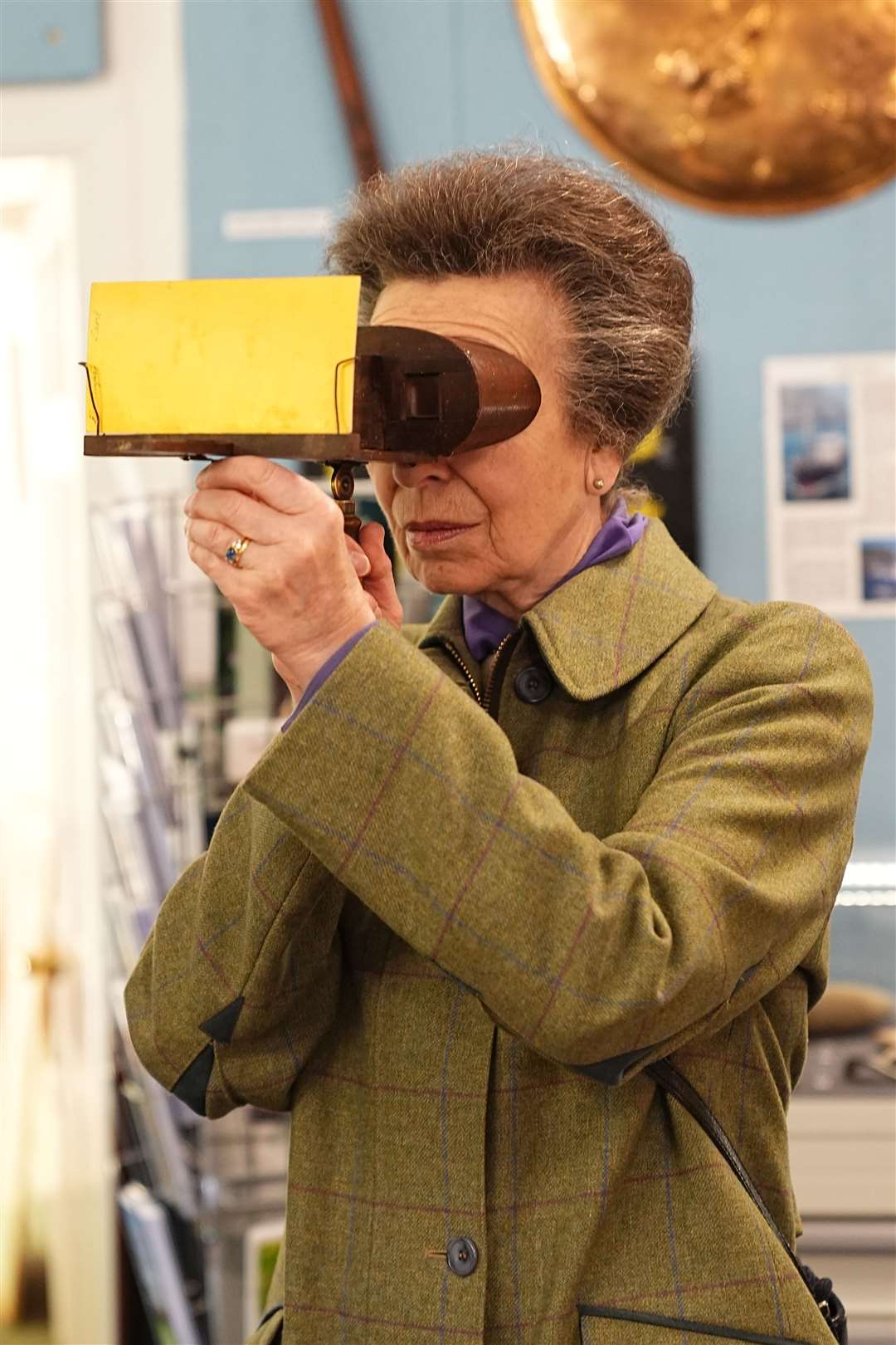 The Princess Royal looking at photos using a stereoscopic viewer during a visit to the Sark Society (Aaron Chown/PA)