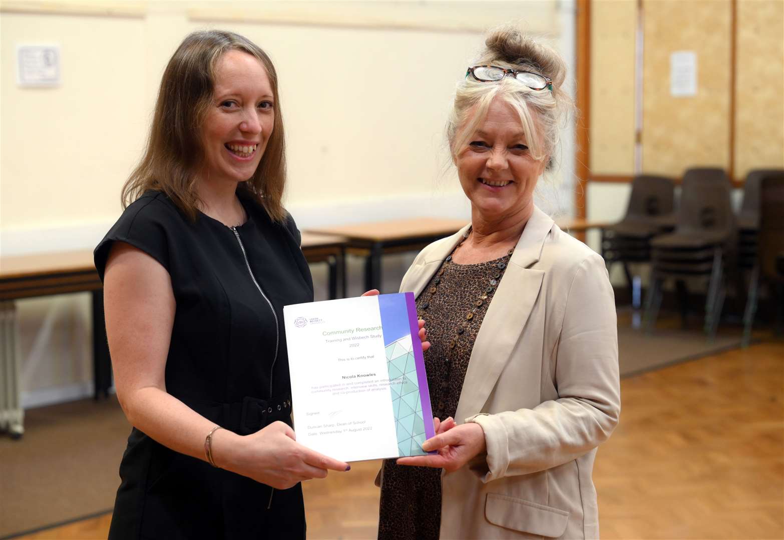 Susan Coan presents Nicola Knowles (right) with her certificate.
