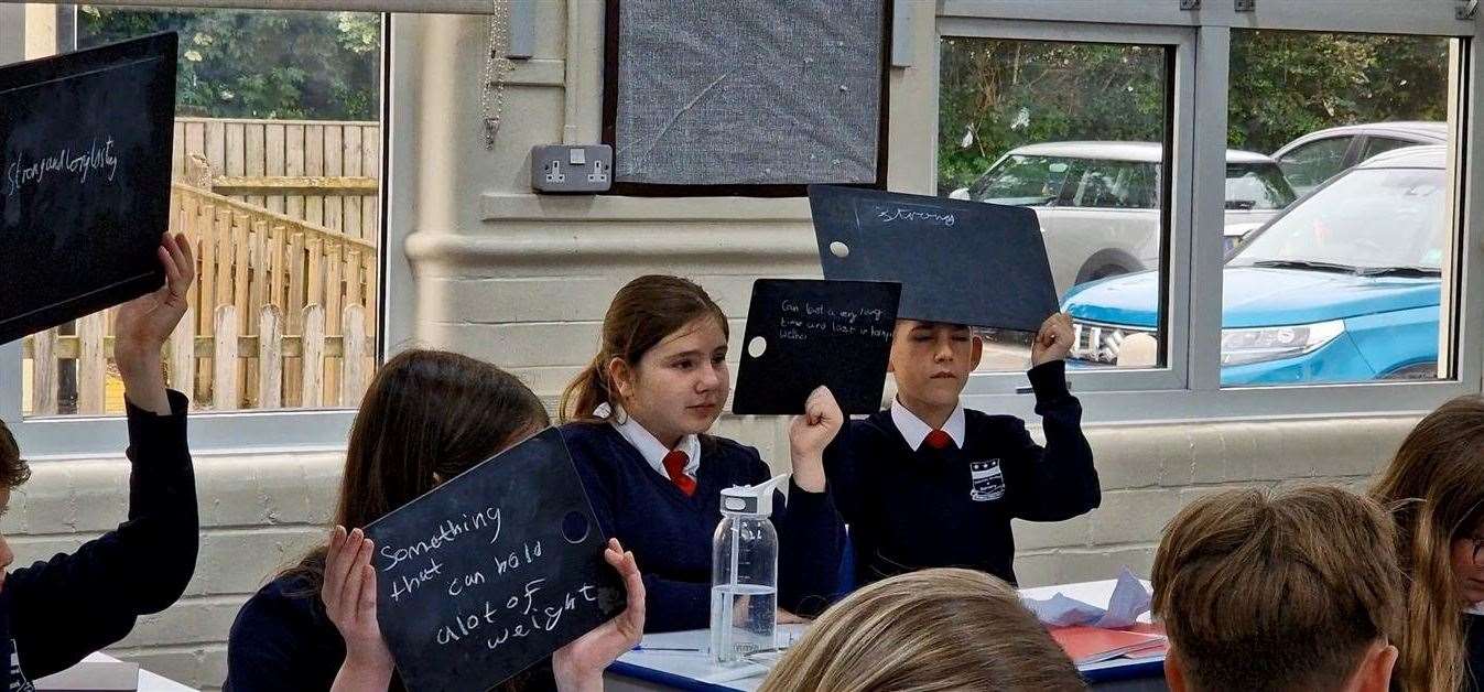 Children using the chalkboards donated by Pentagon Play.