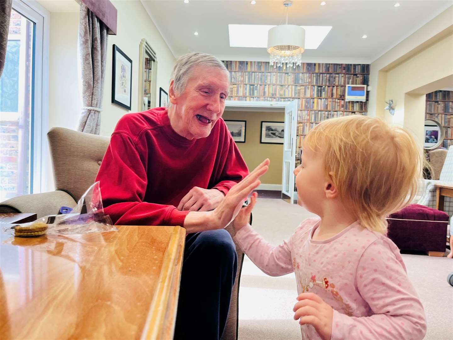 Morning 'high fives' between Rosa and resident, Richard