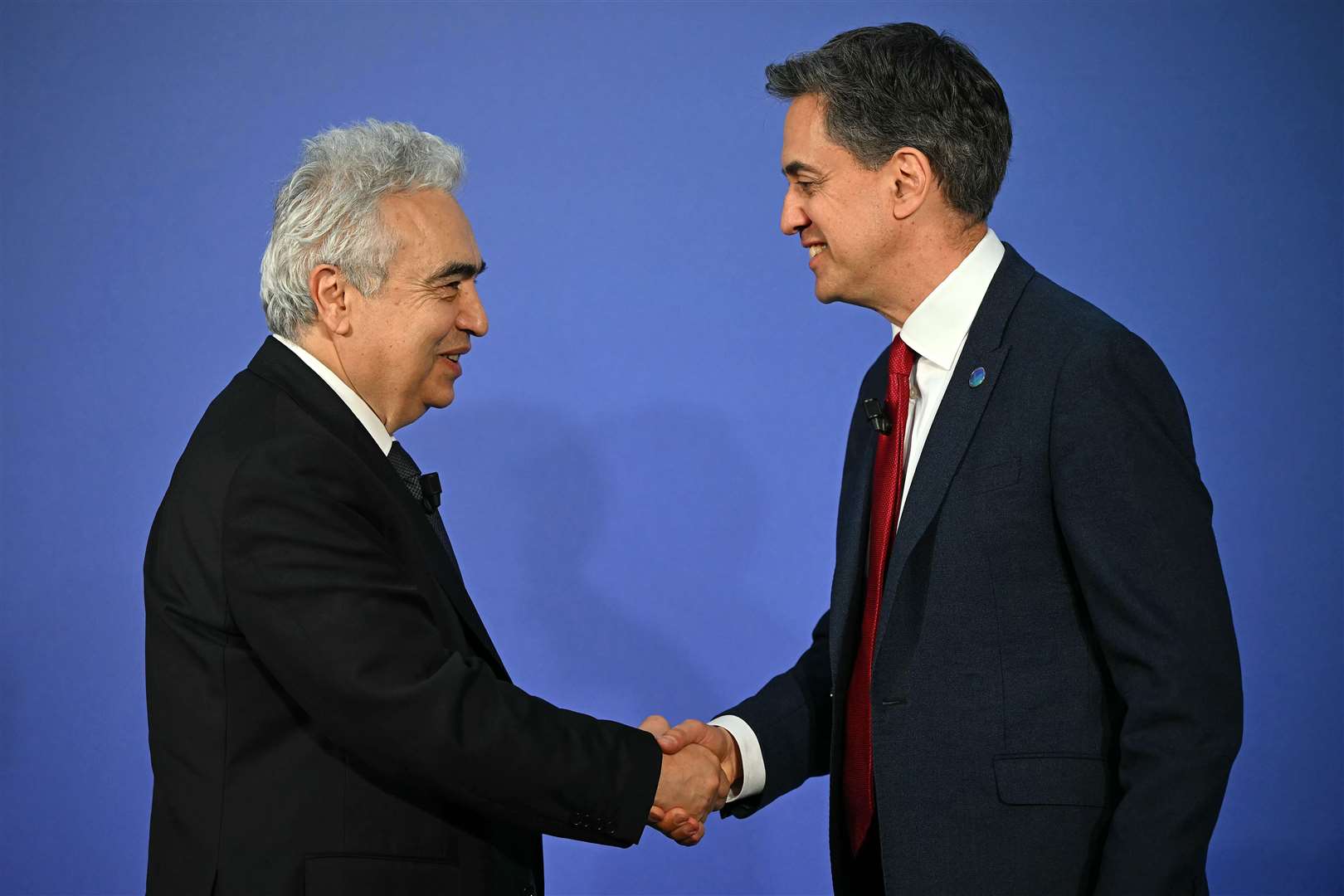 Energy Secretary Ed Miliband greets executive director of the International Energy Agency Fatih Birol (Justin Tallis/PA)