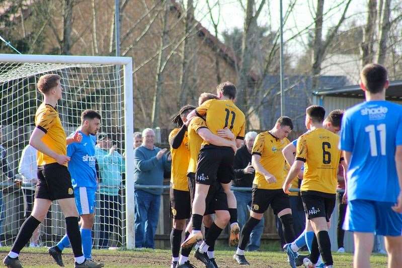 Jack Saunders (11) helps celebrate on of March’s goal. Picture Amber Kent
