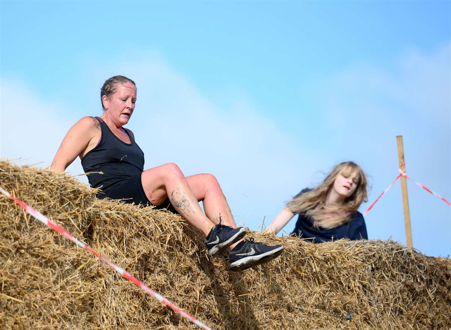 The runner had to climb over obstacles as part of the race