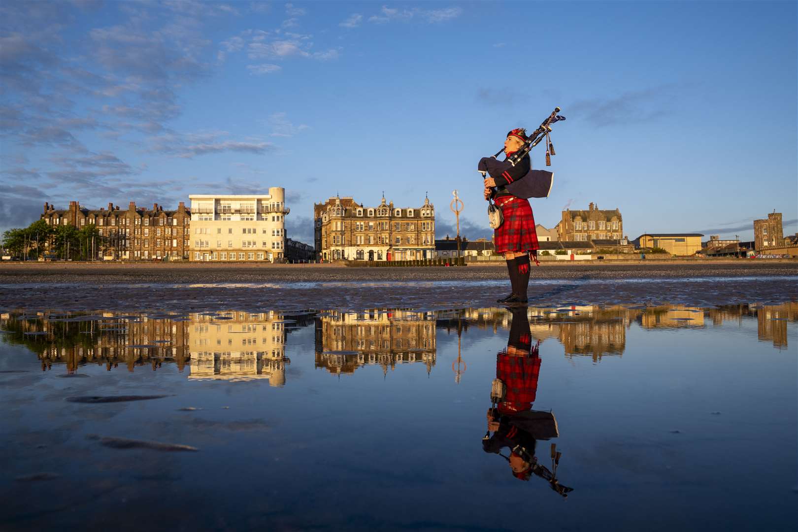 Scotland’s National Piper Louise Marshall playing a lament to the fallen at dawn (Jane Barlow/PA)