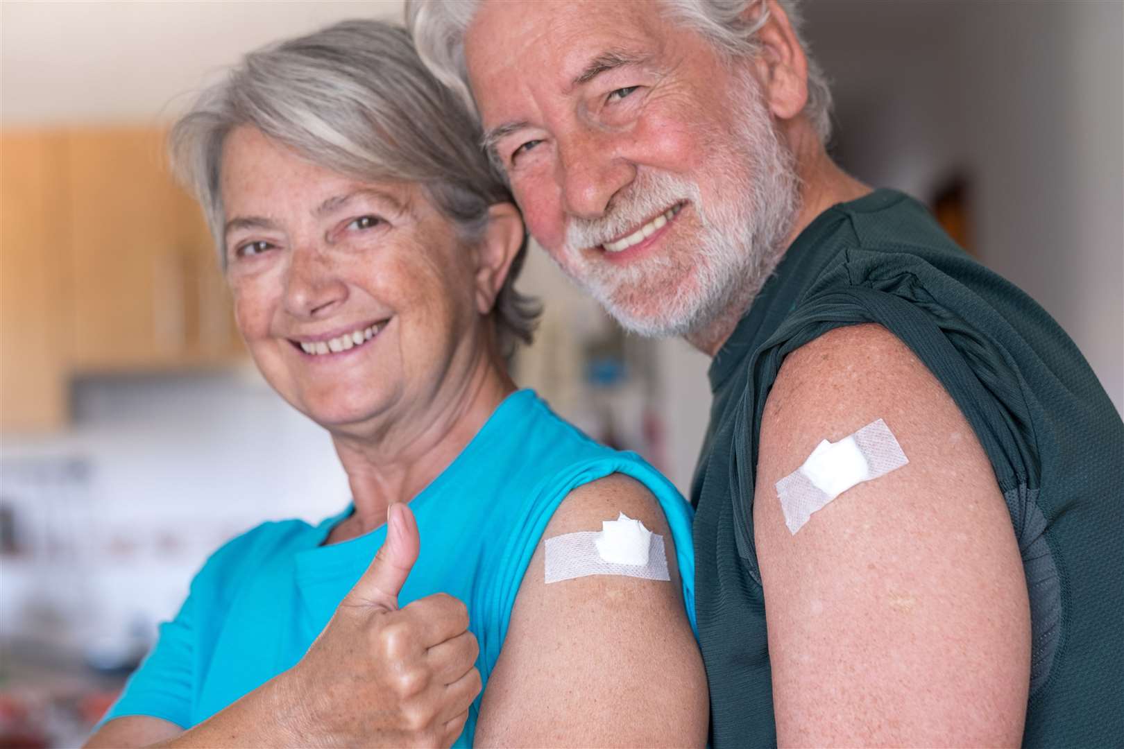 A couple smiling after receiving the booster of the coronavirus covid-19 vaccine. Supplied (60979769)