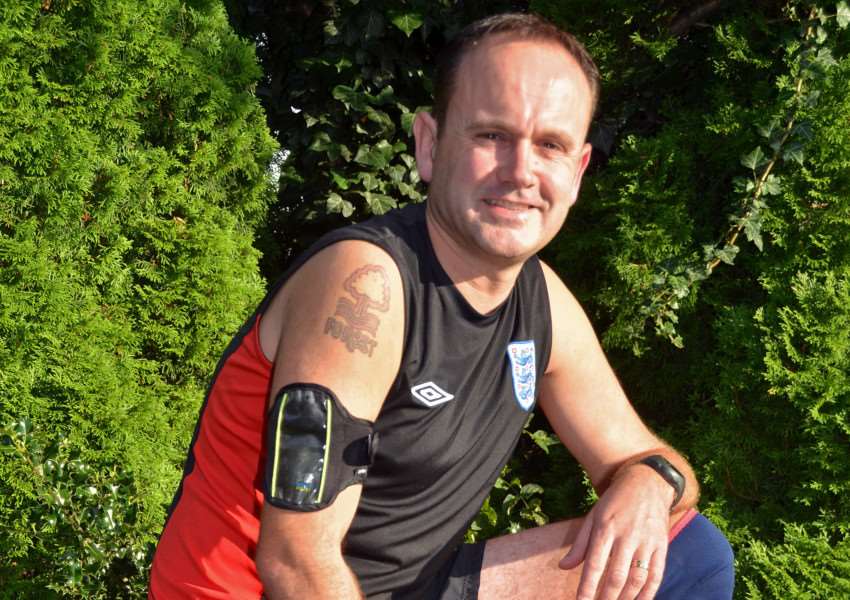 Keen runner and football fan John Cross of Sutton St James who is running three half-marathons on consecutive weekends in memory of his wife's late grandfather Dennis Atkin, believed to be Wisbech's longest serving postman ever after a 52-year career delivering letters and parcels. Photo by Tim Wilson.