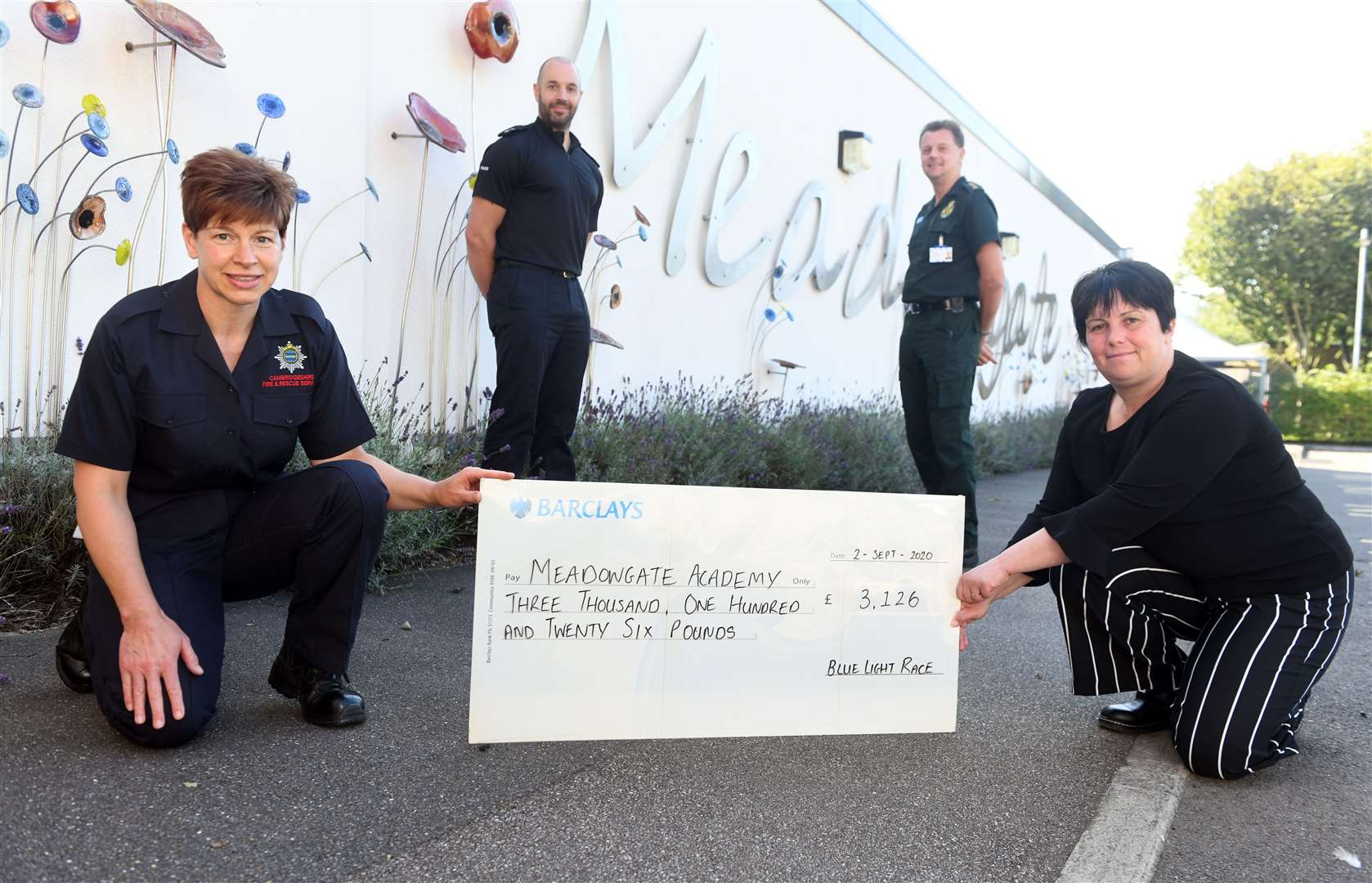 Presentation of a big cheque to Meadowgate School as part of the Blue Light Race..left to right front Nicola Barlow and Michelle Flanz head teacher..left to right back Ian Lombardo and Shaun Reddy. (41840696)