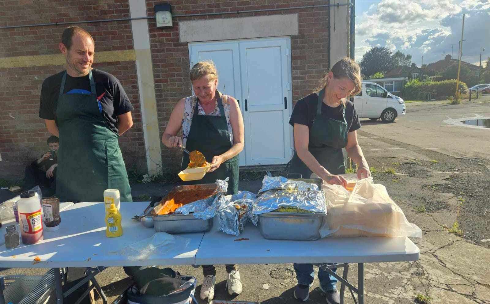 Volunteers from Feed Fenland serve food to those in need