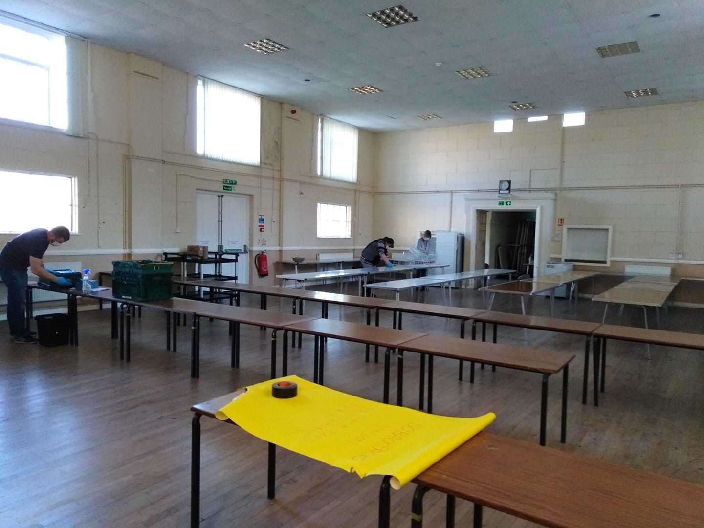 Volunteers clean St Peter's Church Hall with anti-bacterial cleaner ahead of making up boxes of supplies for the vulnerable. (32504766)