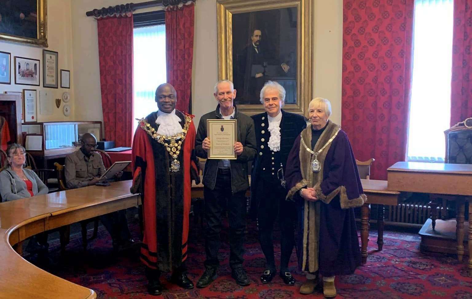 George Rowlett received his certificate in recognition for his work in turning Ghost Passage from a dingy cut through, to a floral walkway. He is pictured with mayor Sidney Imafidon, the High Sheriff, and deputy mayor Janet Tanfield