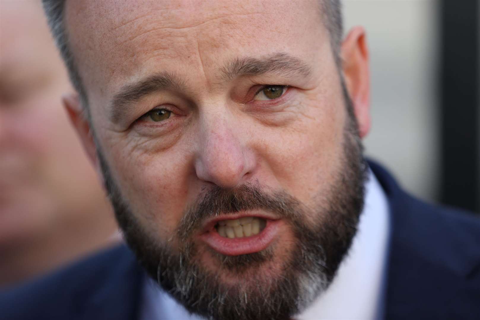 Former SDLP leader Colum Eastwood speaks to the media outside court (Liam McBurney/PA)