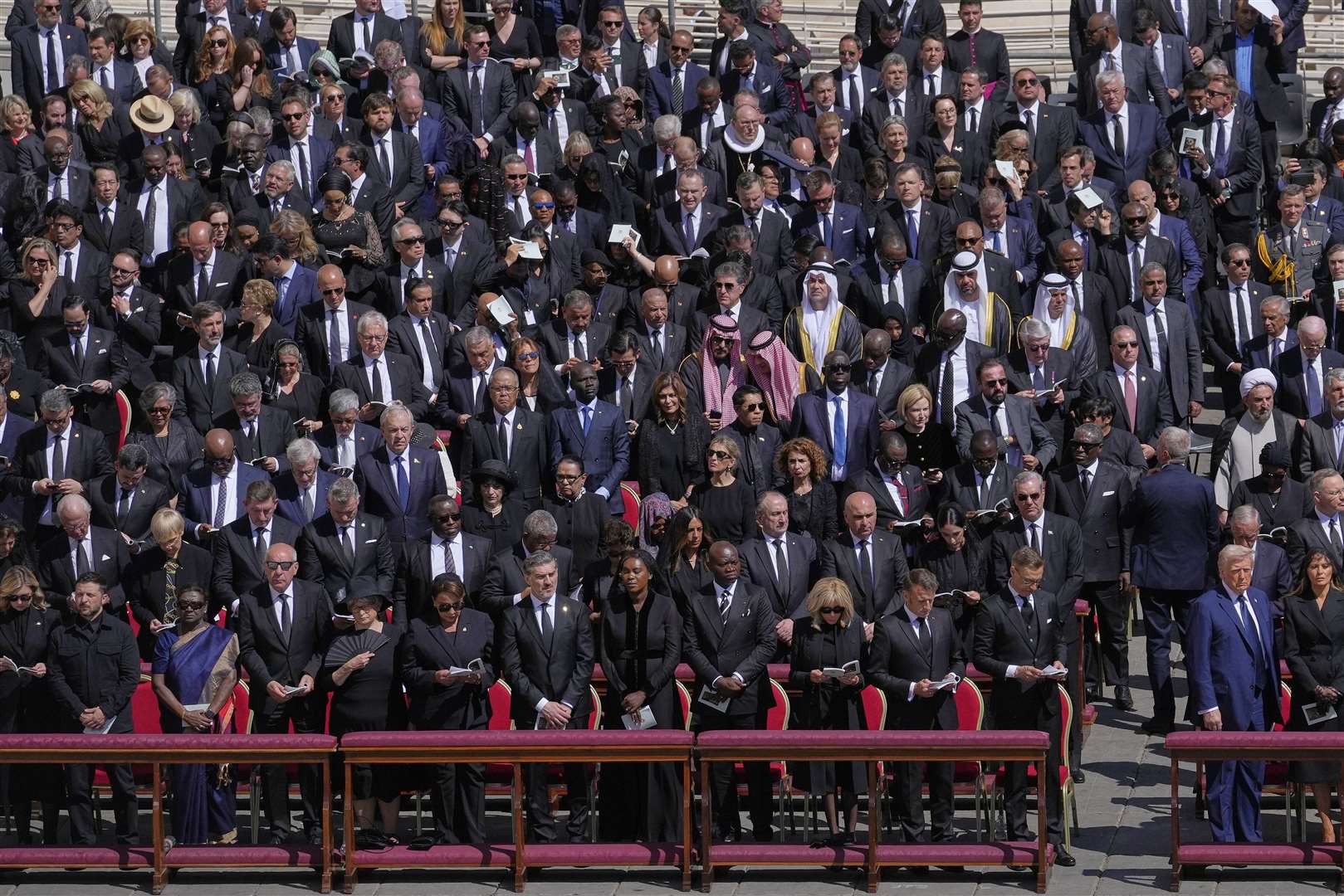 President Trump, (front second from right) and Ukraine’s President Volodymr Zelensky (front second from left), with other dignitaries (Gregorio Borgia/AP)