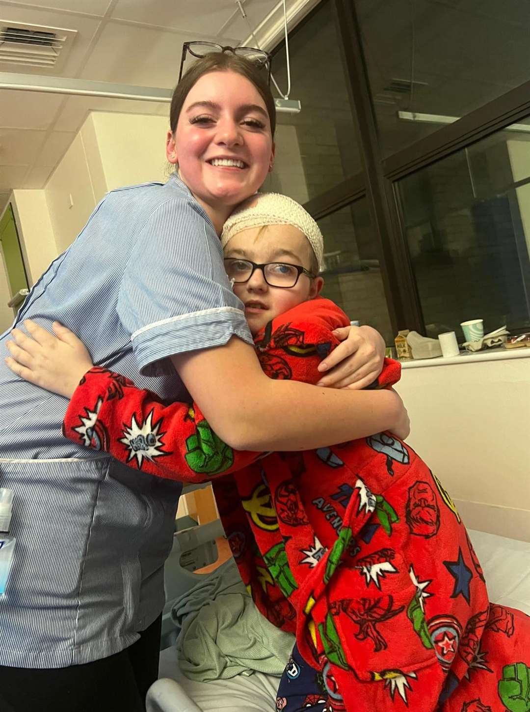 Jack Naish hugs his nurse