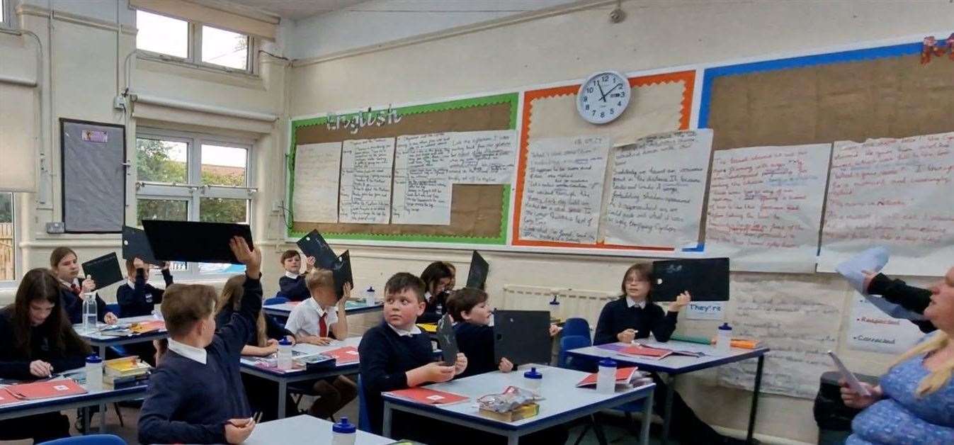 Children using the chalkboards donated by Pentagon Play.