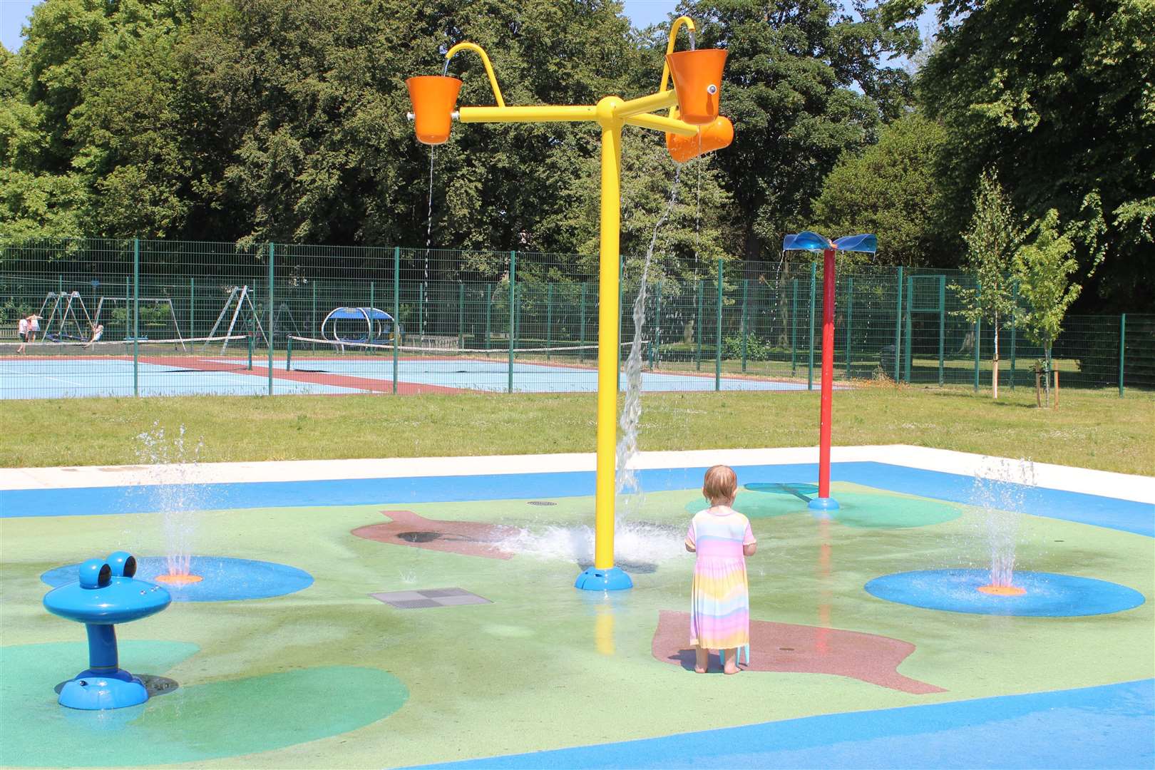 A toddler enjoys Wisbech Splashpad
