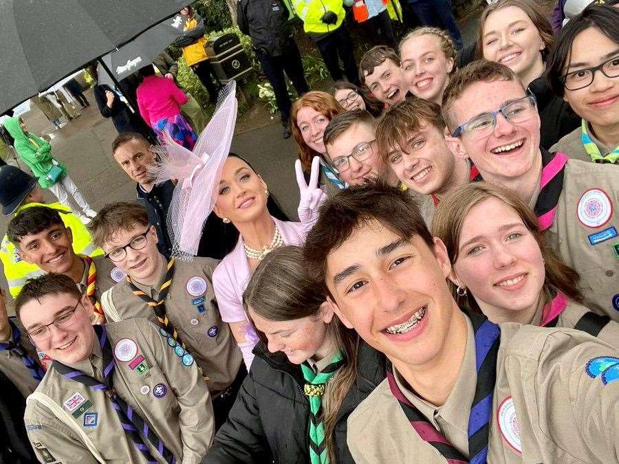Henry Fuller from Wisbech was among 50 scouts invited to attend the coronation from across the country. He was even lucky enough to meet singer Katy Perry and is pictured standing to her left.