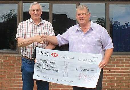 Councillor Will Sutton (left) receives the cheque from Mick George. (14997775)