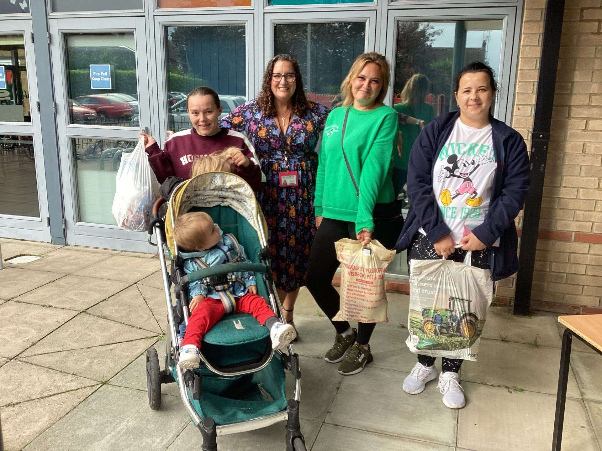 Parents happily collected a bag of goods at the end of the school day as part of the harvest festival bag swap from left: Parent Miss Catton, headteacher Sarah Cullen and parents Miss McCulloch, and Miss Kirilova.